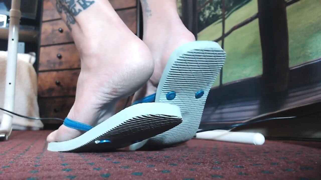 Filthy blue flip flops worn out