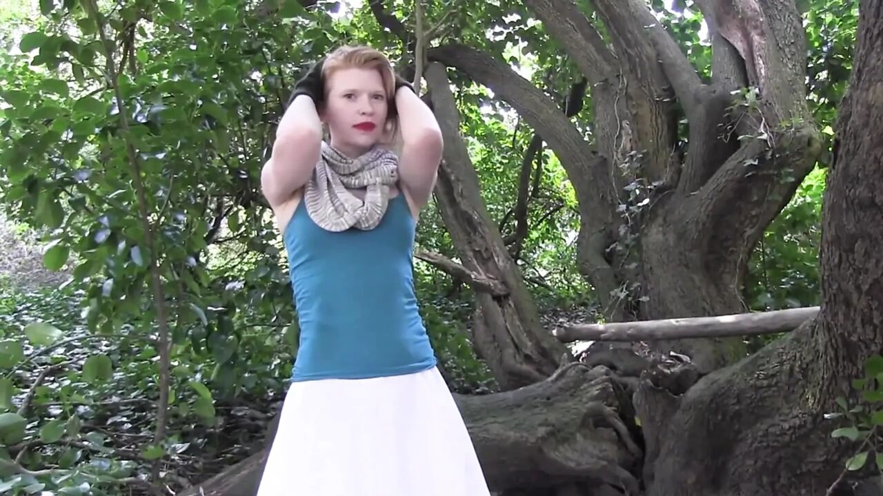 She climbs on tree and fingers her pussy