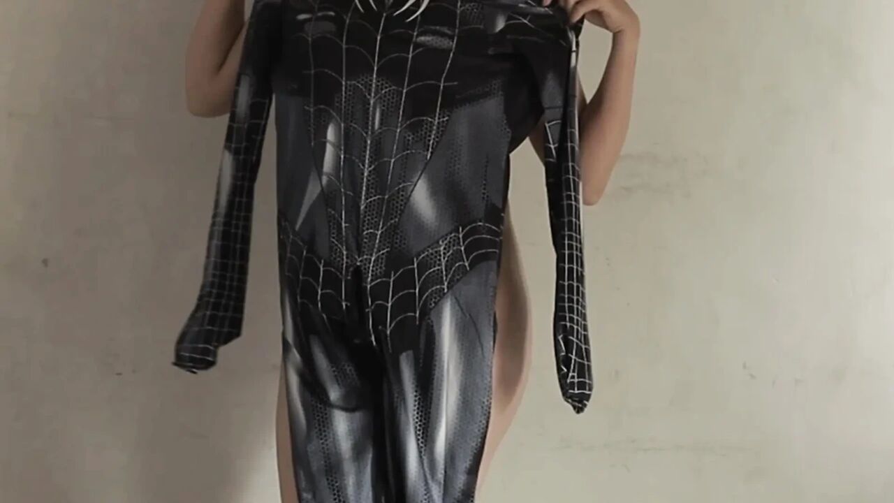 SPIDERMAN COSPLAY GIRL IS TRYING ON HER COSTUME AND EVEN GETS STUNG UNTIL IT COMES OUT IN THE PUSSY
