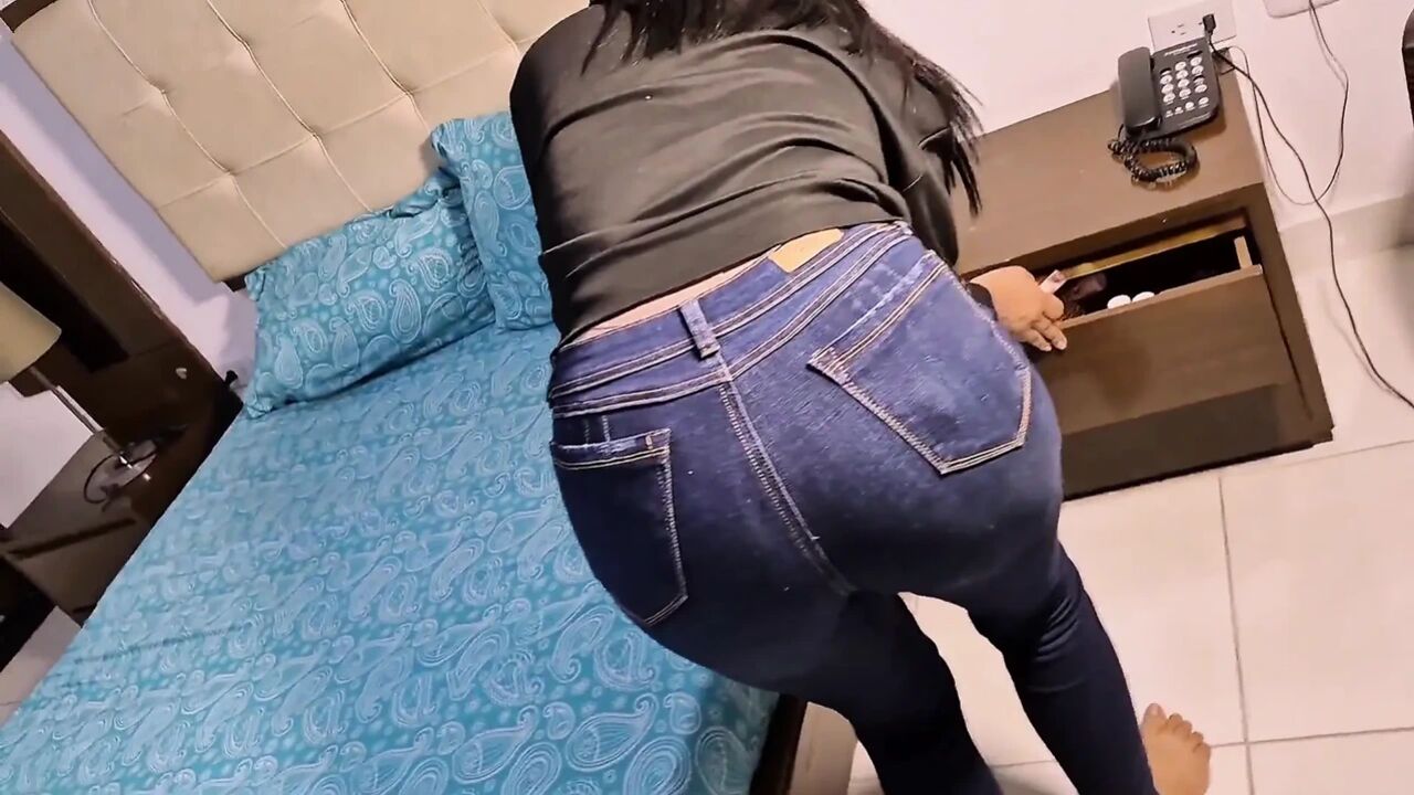 Brunette with Jeans, Making Pink Lipstick in Her Mouth to Taste the Dick of Her Boyfriend