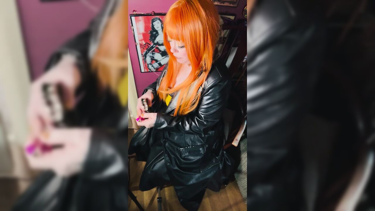 The Gothic Cutie Tina Snua Dressed In a Leather Coat & Smoking A Cork 100 Cigarette - Ginger Miss Smokes In A Leather Outfit OME