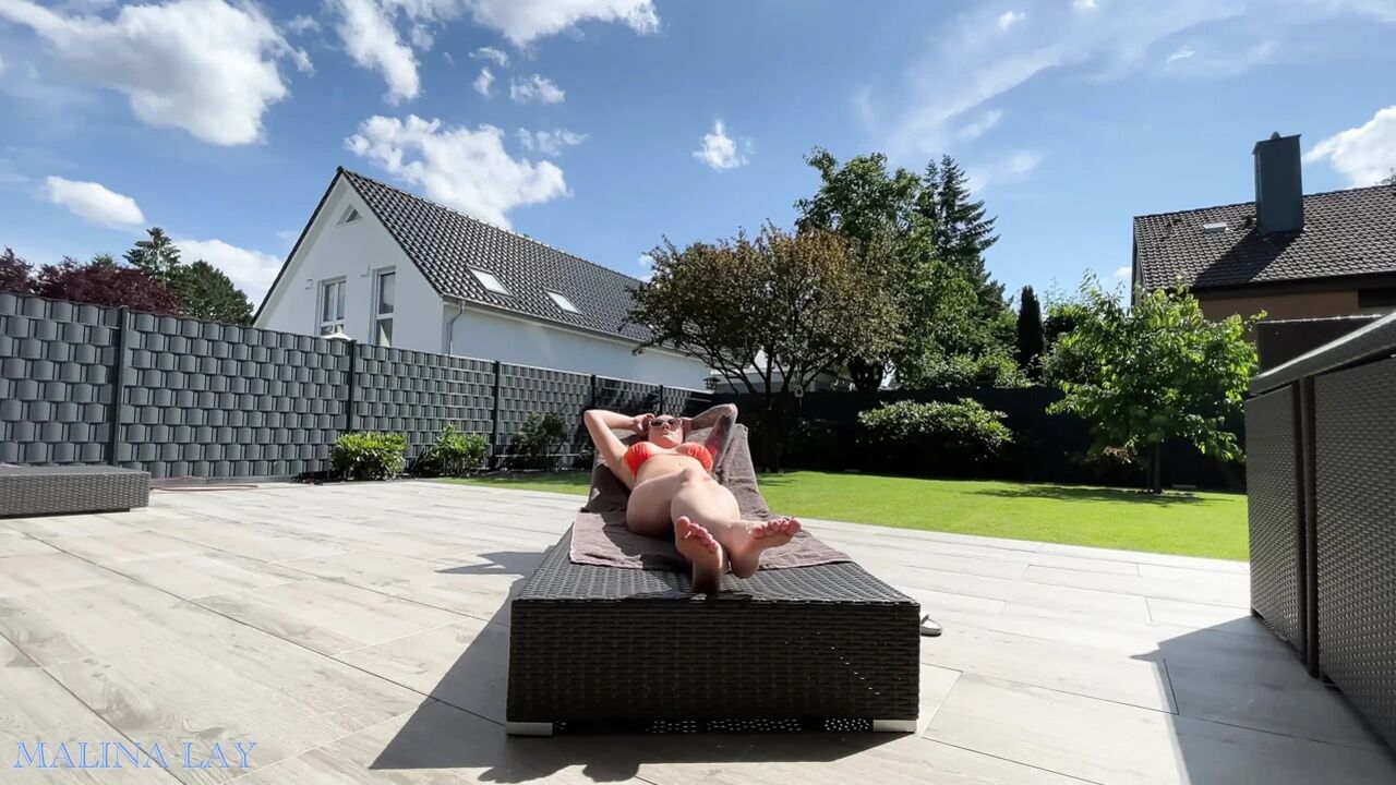 Hot milf pampers her sexy body on the terrace and oils herself