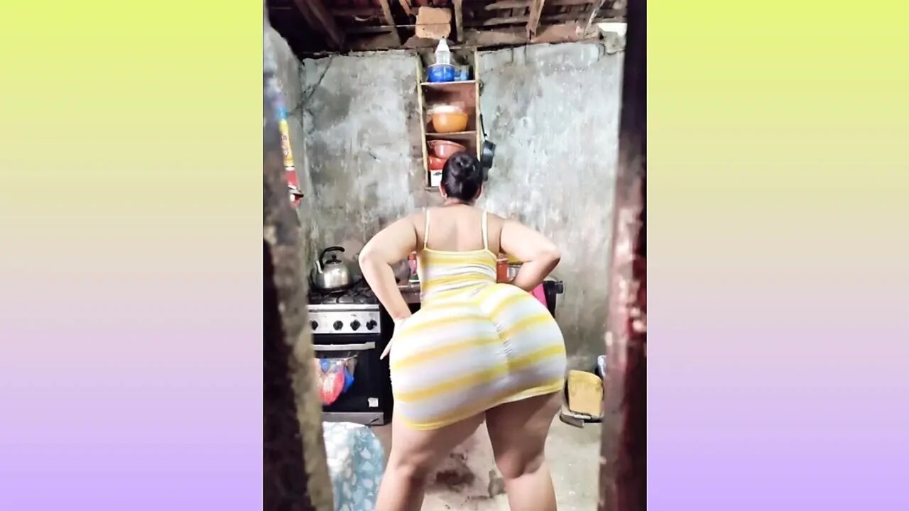 big-bootied woman dancing in her striped dress