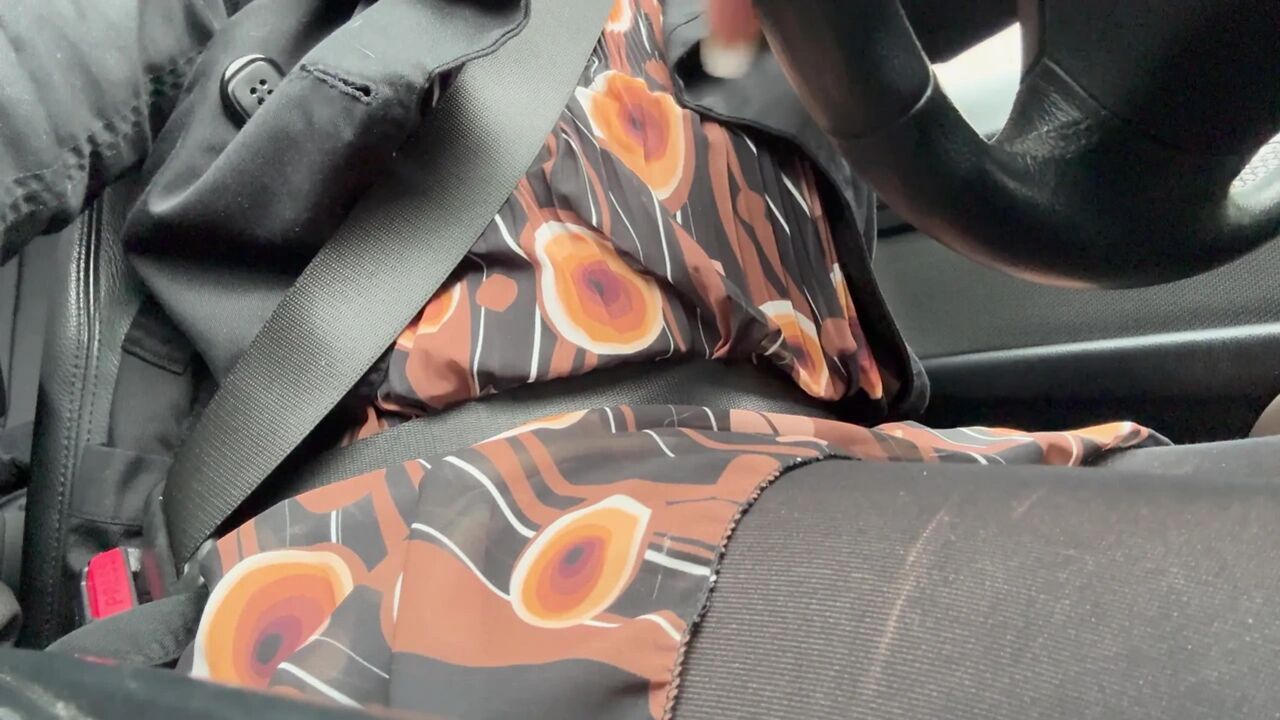 Elegant stepmom drives to the office wearing tights and a beautiful dress