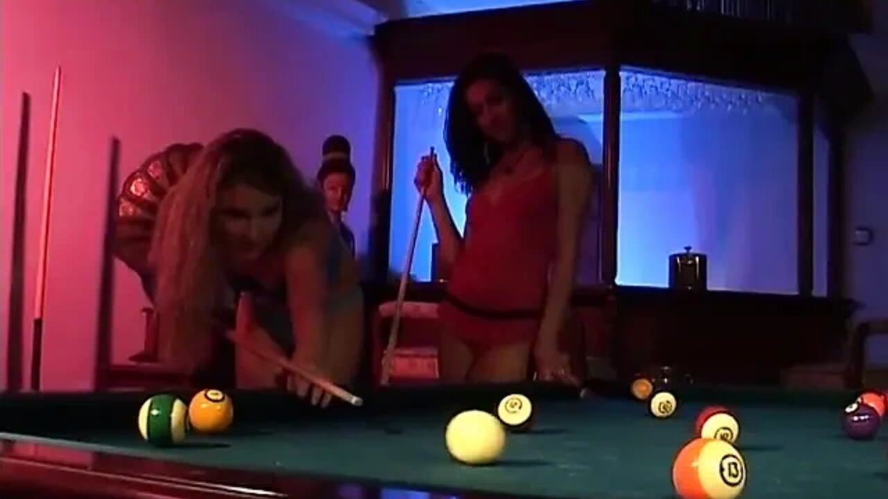 Sensual girl playing billiard, targeted by a lesbian and fucked with a dildo