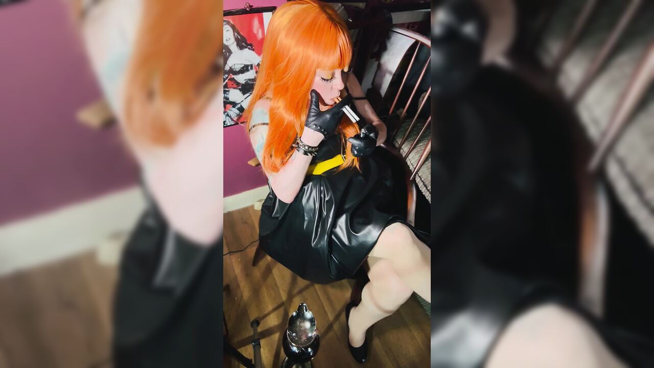 Redhead Tina Snua Smoking 2 Cigarettes At A Time Wearing A Leather Dress & Gloves