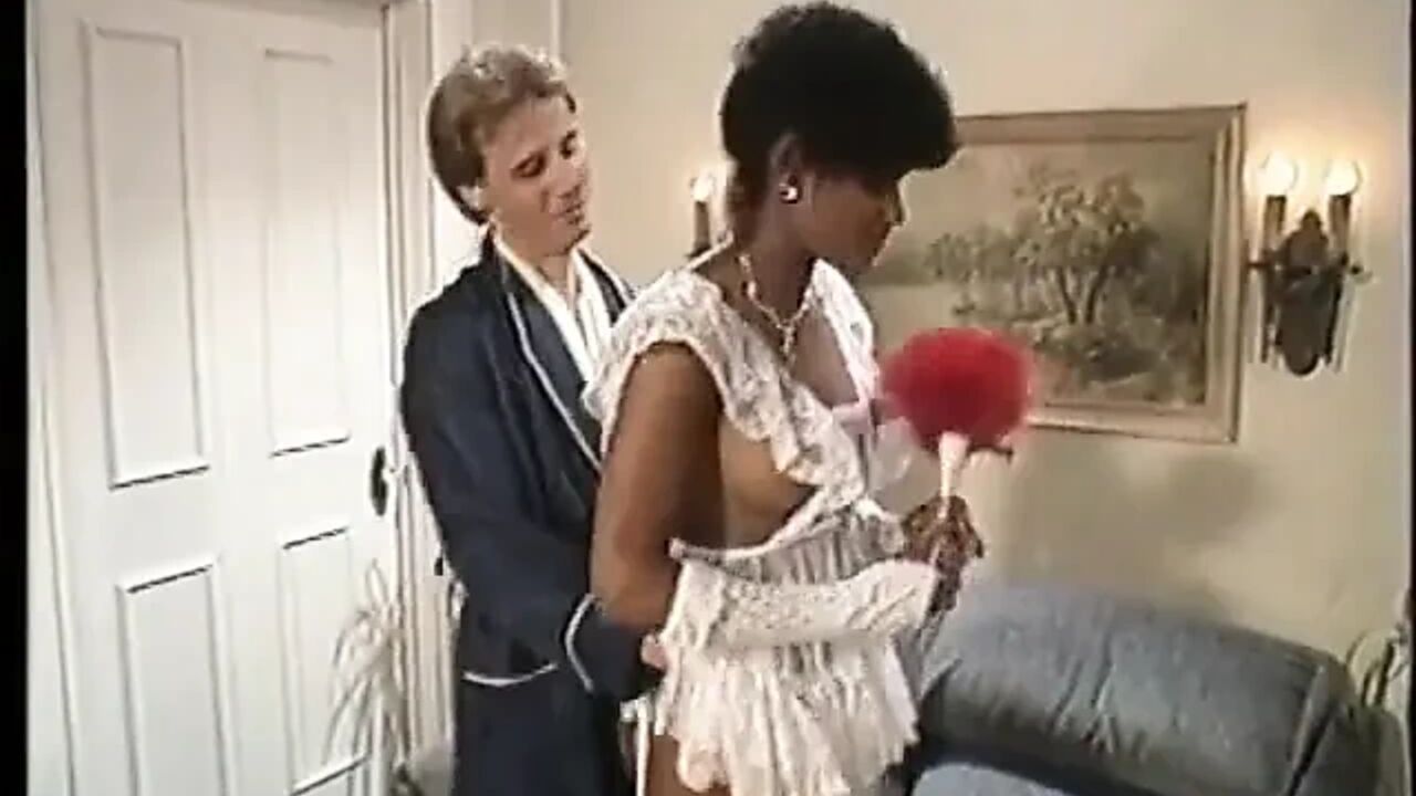 Hot ebony in white lingerie takes cock on a couch