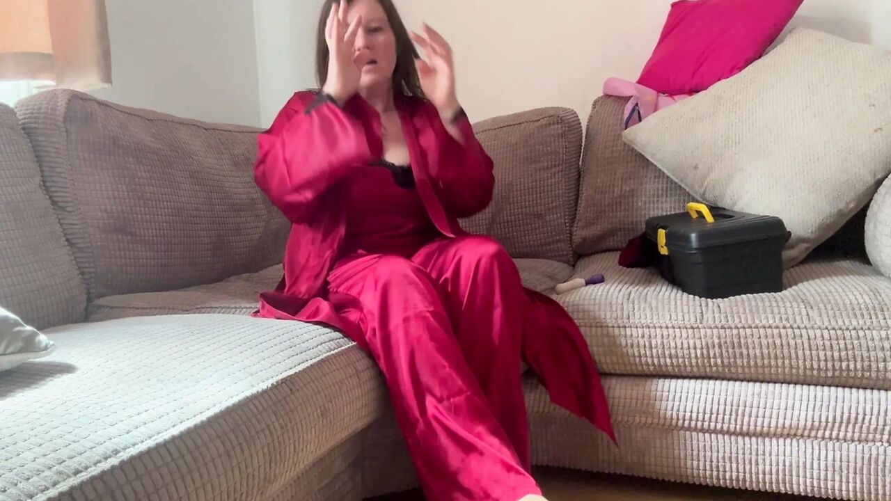 lady in red multiple orgasm enjoying stripping off in the window where everyone can see in while she pleasures herself