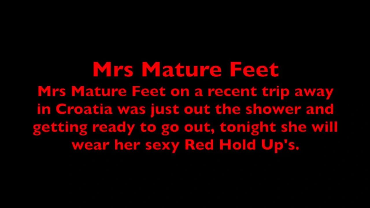Mrs Mature Feet putting on her Red Sexy Hold Up's 405