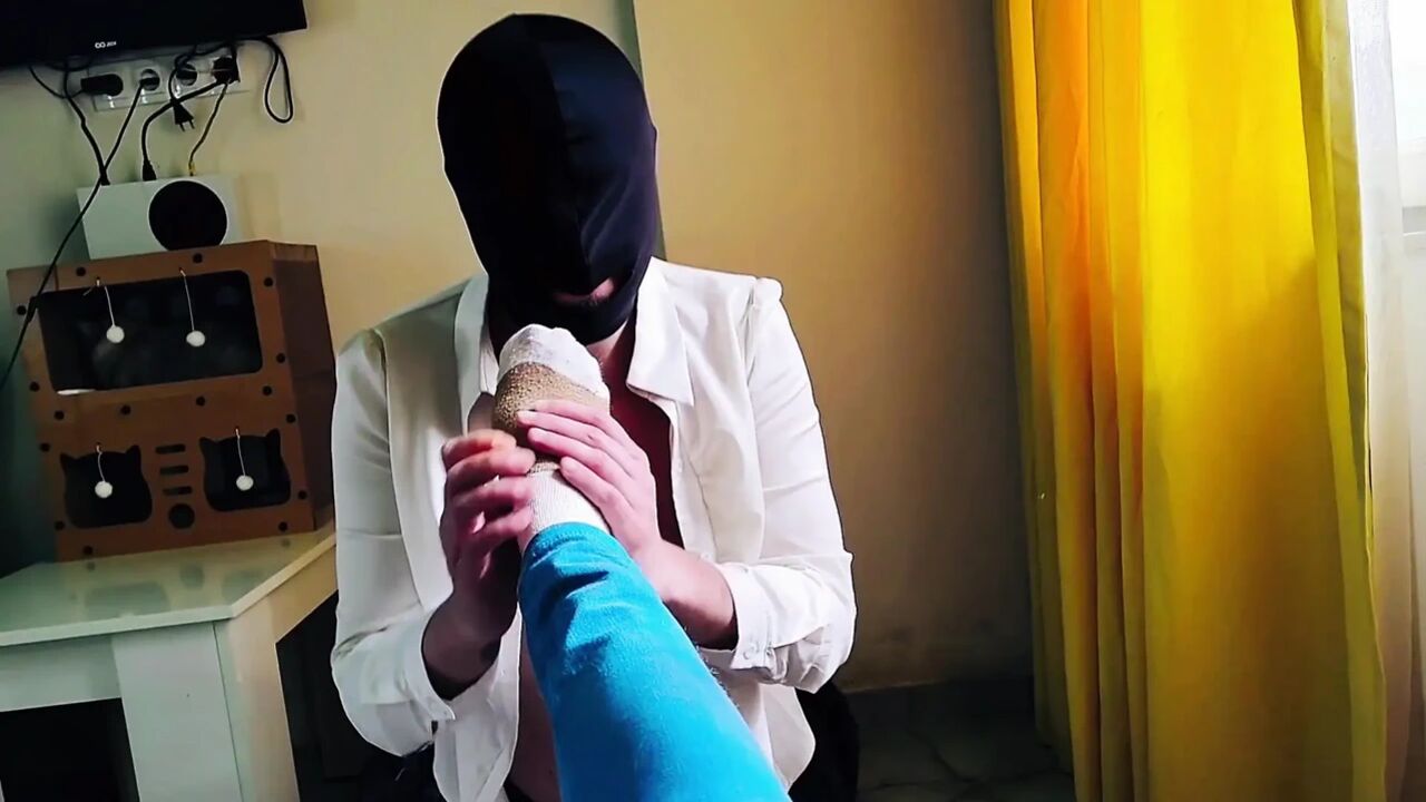 A slave gives me a foot massage in socks and sniffs my firm legs. Sock fetish, foot worship. POV.