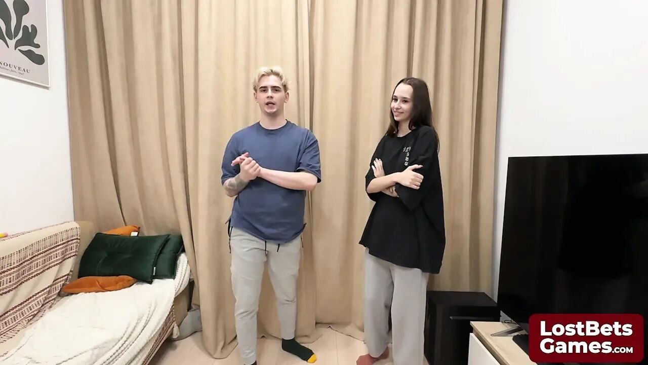 James and Sofia engaged in a strip hand-slap game