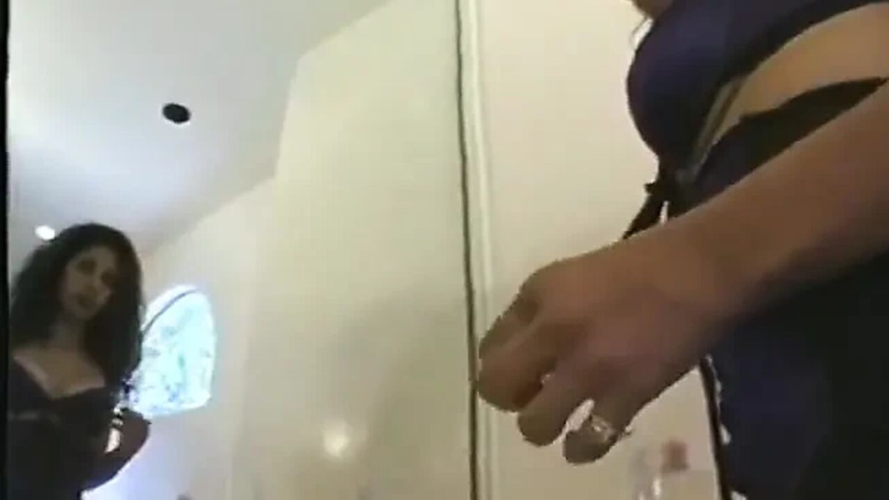 Curly hair brunette spreads milk on older guy's big cock after fucking hard in the bathroom