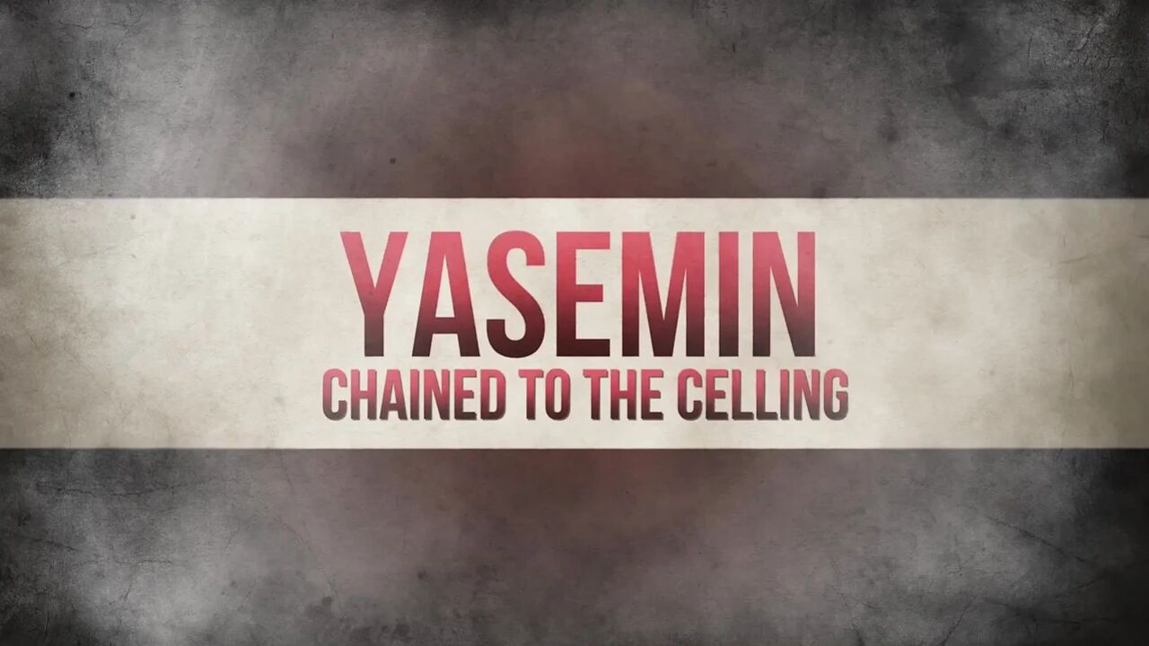 Yasemin chained to the ceiling