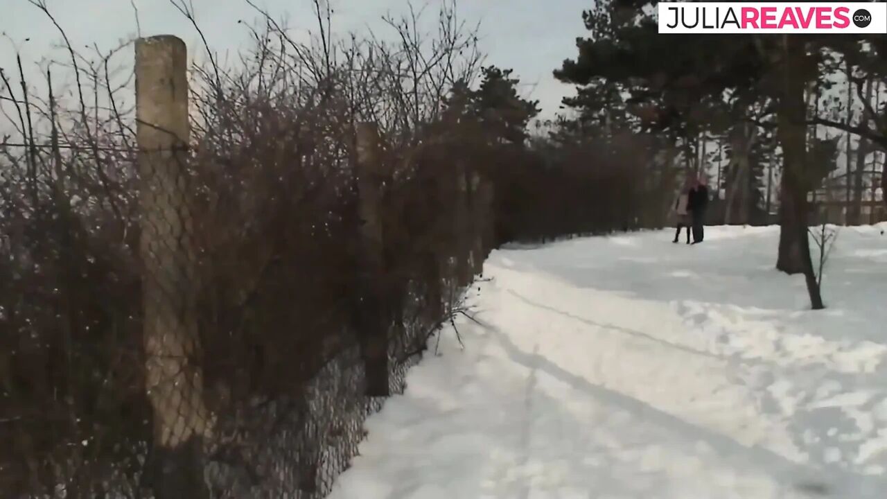 Sexy redhead rides a hard cock out in the cold snow