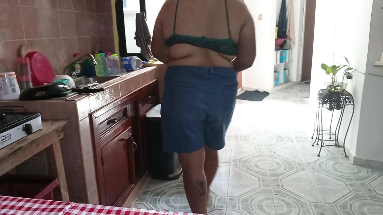 Mom in the kitchen in bralett