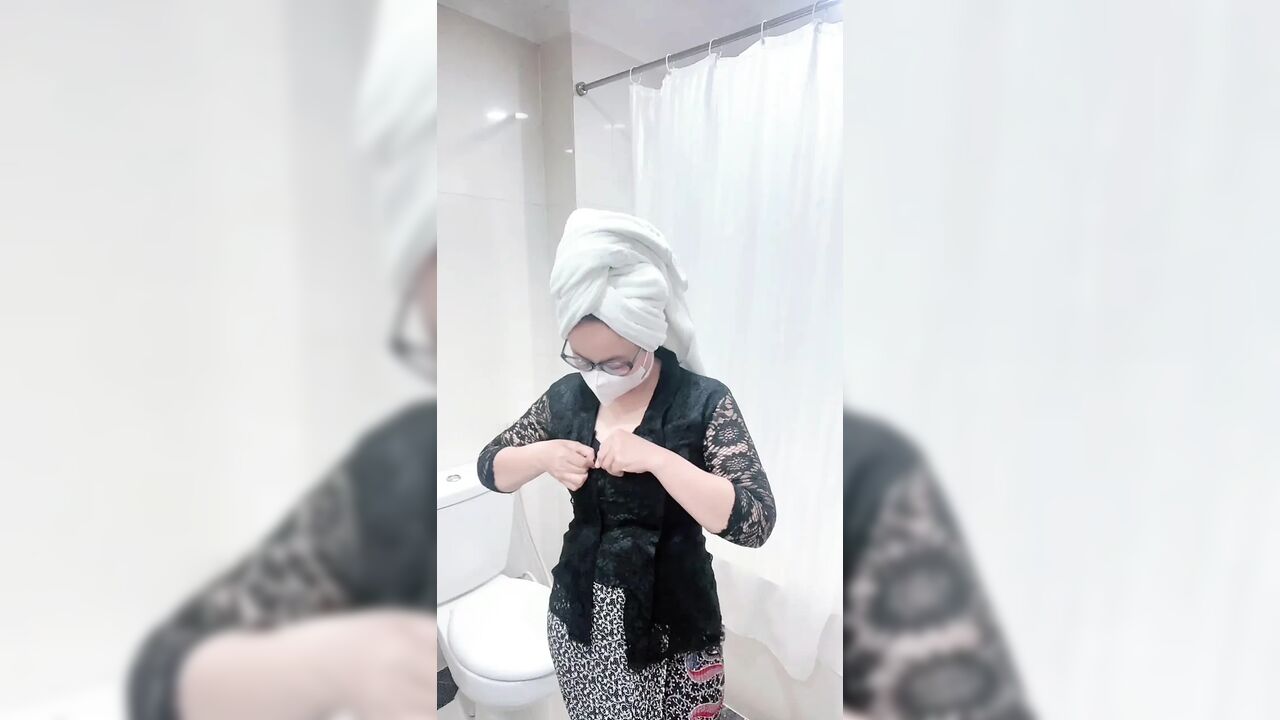 The charm of a black kebaya woman takes a shower and masturbates