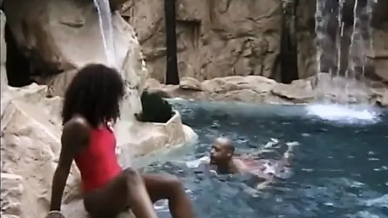 Ebony slut gets her pussy licked and fucked on the nature against the waterfall
