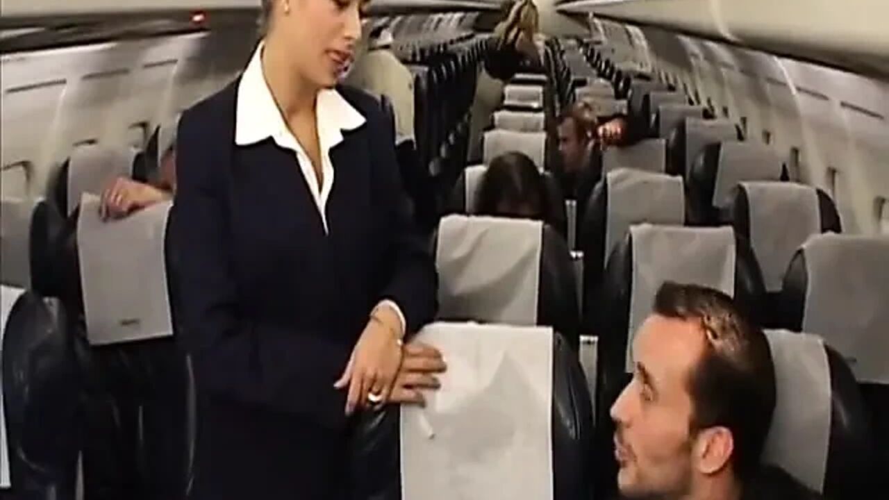 Sexy flight attendant rides passenger's cock after the flight