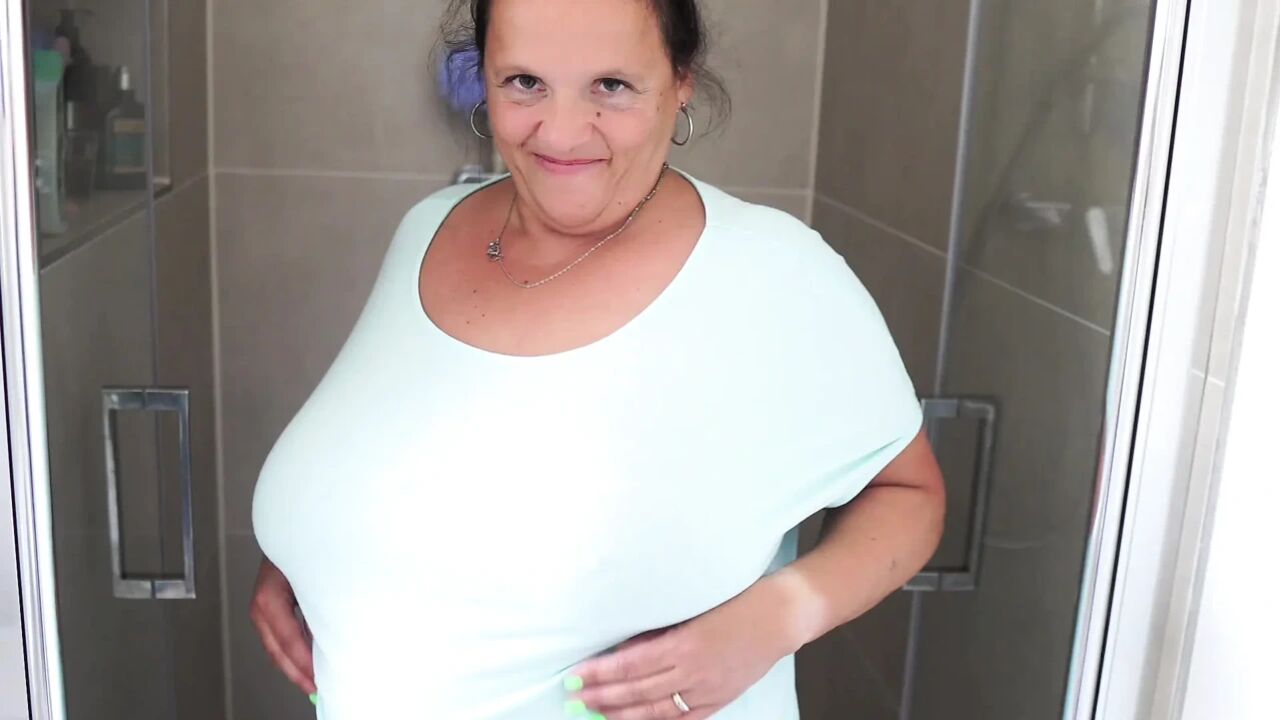 Mature Brunette with Massive Tits Gets Steamy in the Shower