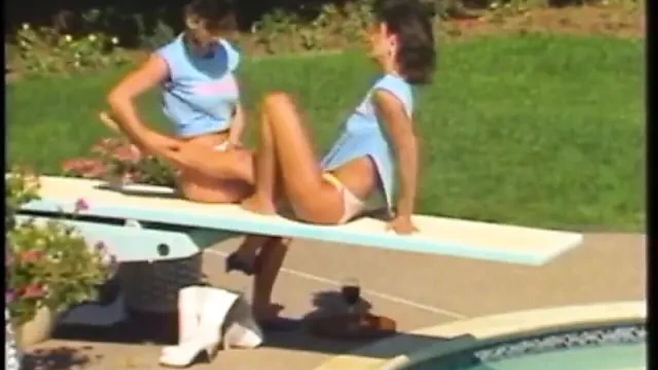 Sexy brunette babe rides her friend's huge strap-on with her tight twat