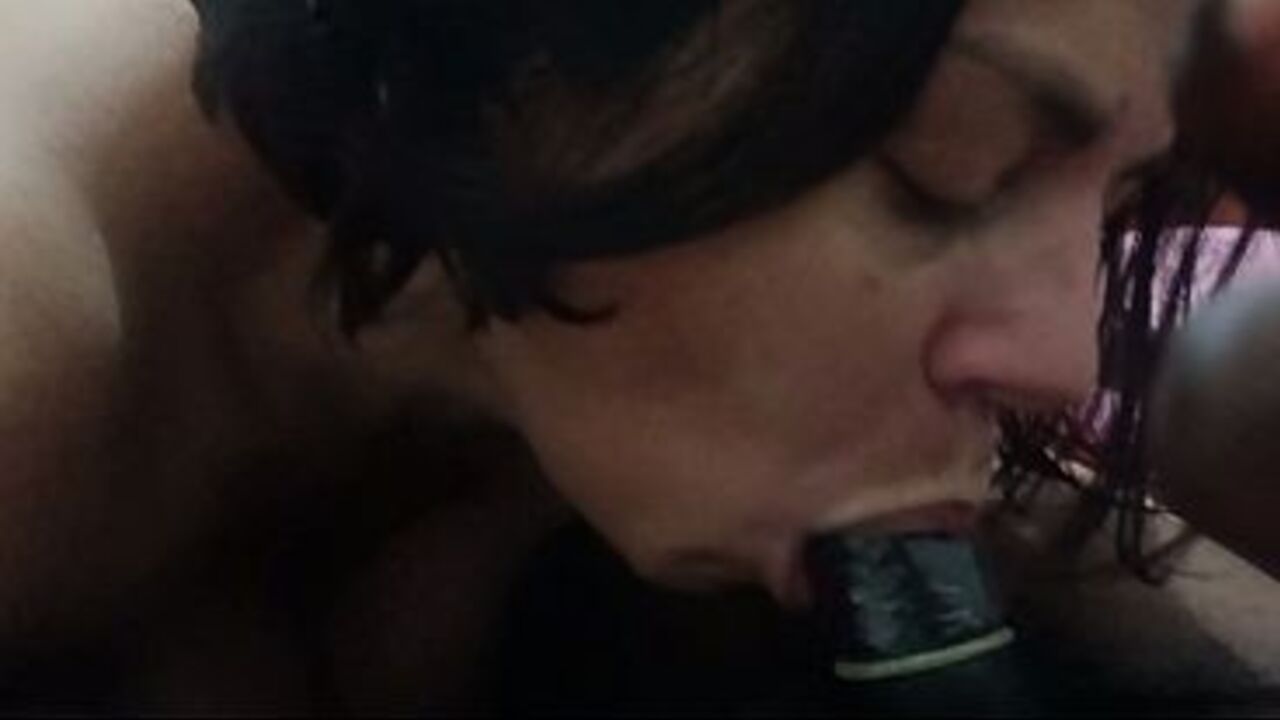 Performing oral sex in the bedroom.